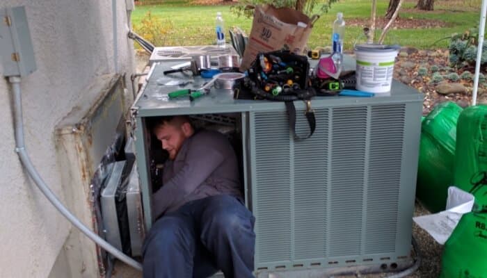 Technician Working In Packaged Hvac Unit 1